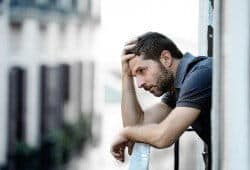 Man hanging his head