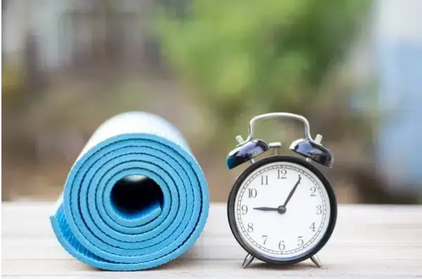 A rubber mat with a built-in alarm clock