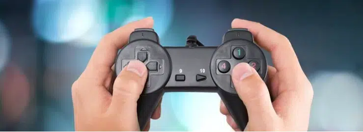 Close-up of hands gripping a video game controller