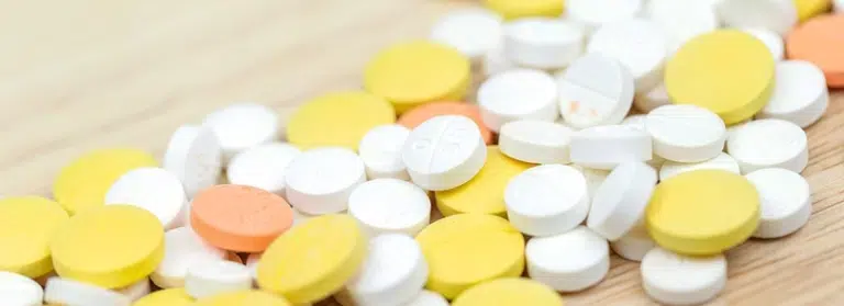 Medicine pills scattered on a table