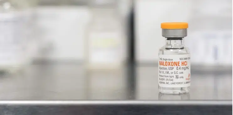 A small medicine vial of injection on a counter
