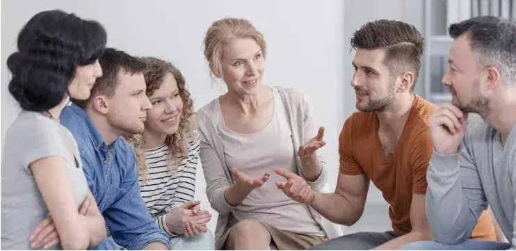 A diverse group of individuals engaged in a discussion