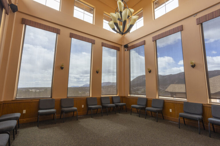 The Recovery Village Palmer Lake Drug and Alcohol Rehab - peer support room with mountain range